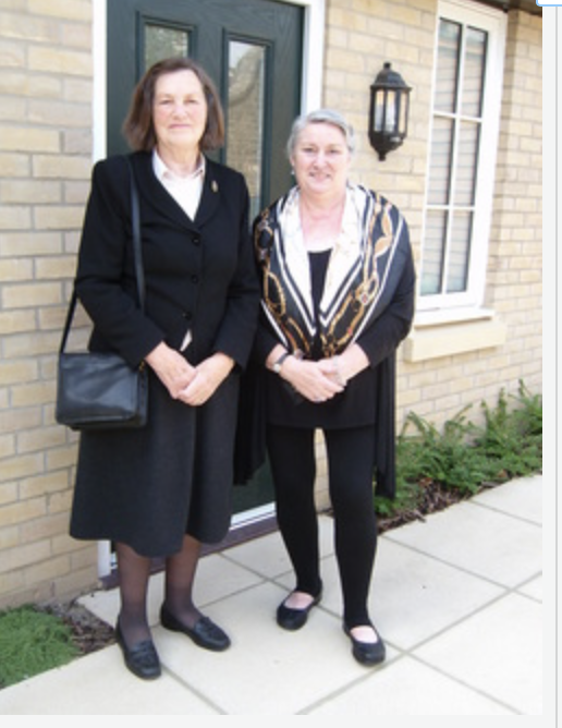 Two women standing outside the Whitworth House extension